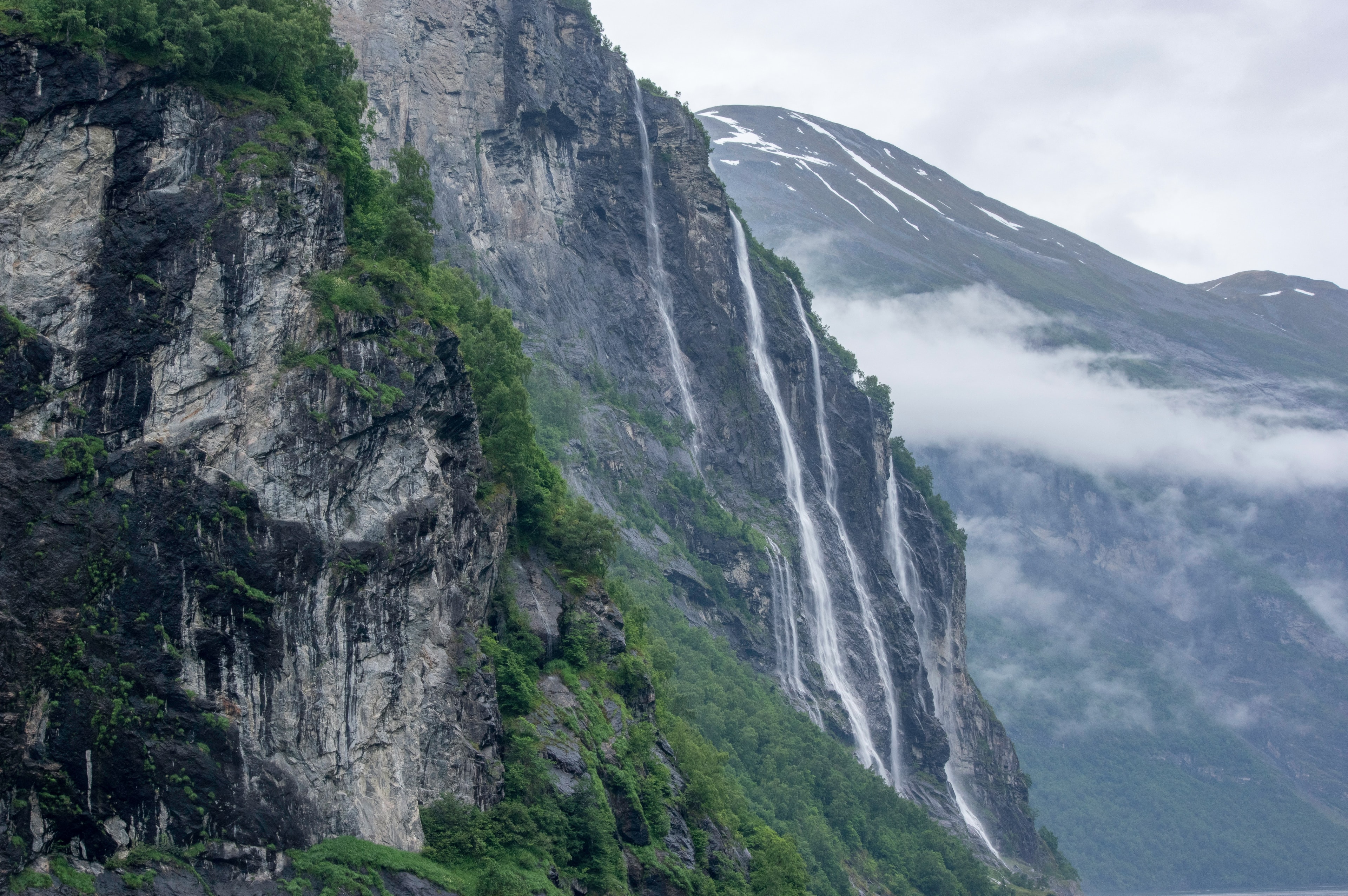 Norwegian cliffs and waterfall in soft light