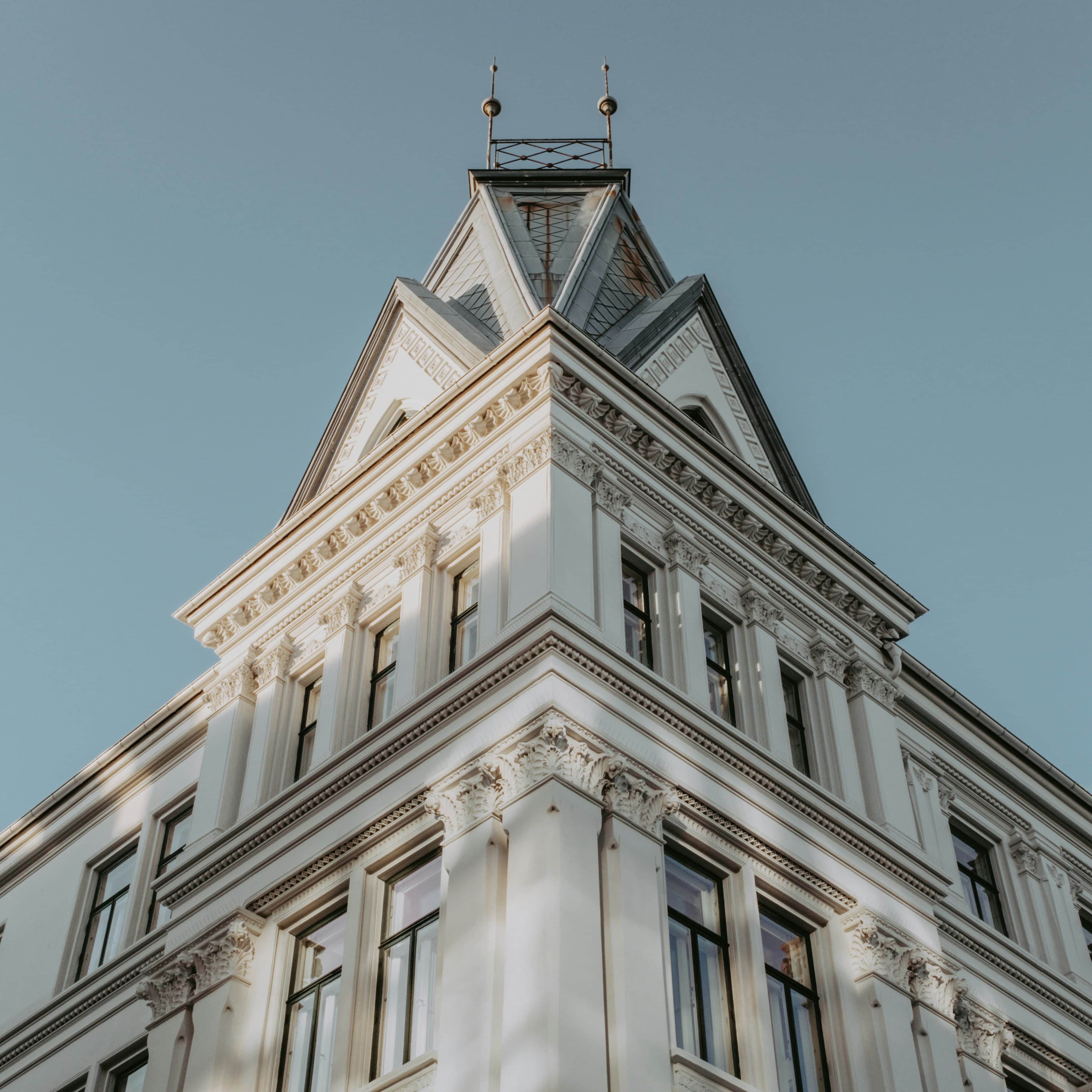 Classical Norwegian architecture against a clear sky